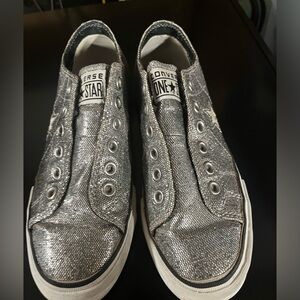 Silver sparkles converse.